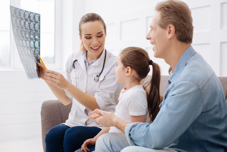 Clinician explaining procedures and information to a family