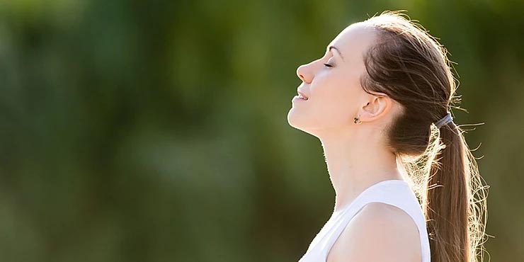 Woman smiling serenely outside Woman smiling serenely outside