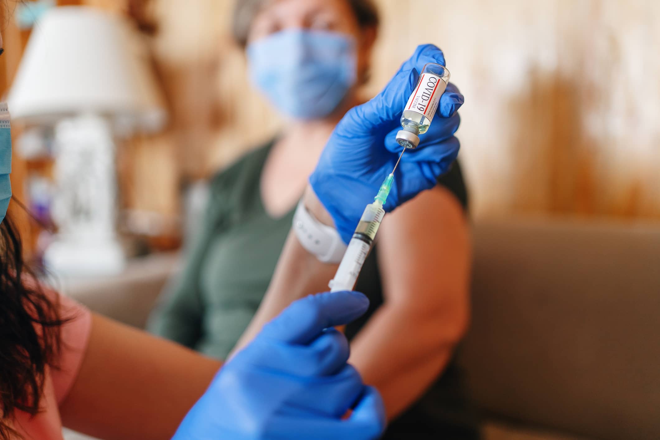 nurse administering covid vaccine nurse administering covid vaccine