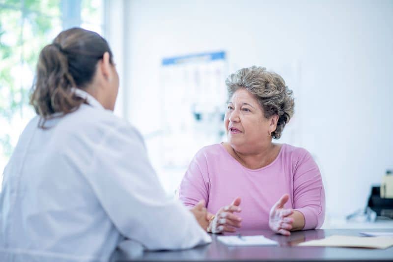 female doctor consulting female patient