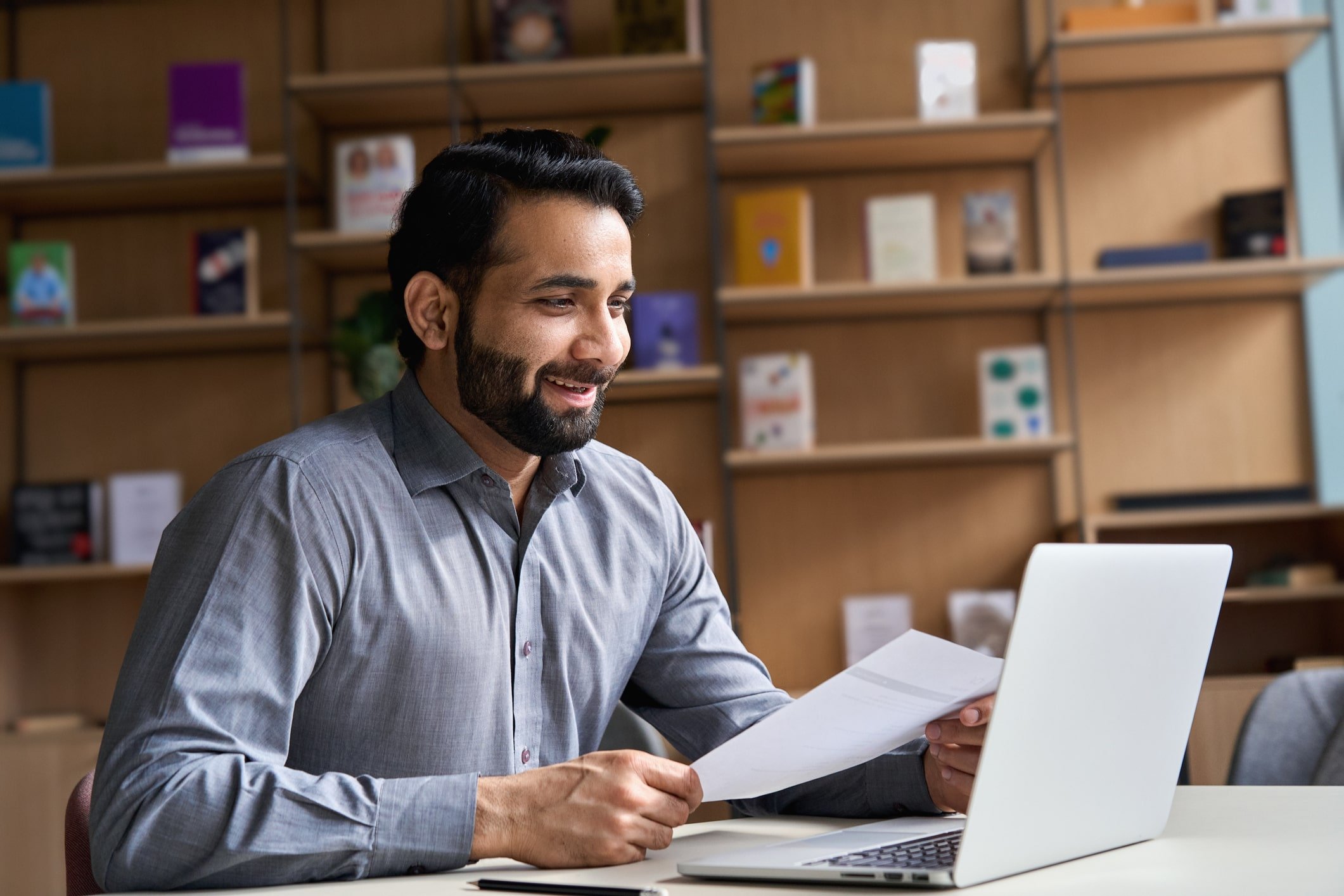 smiling man interviewing on laptop smiling man interviewing on laptop