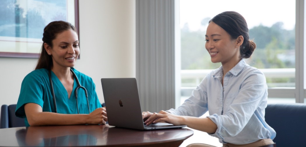 businesswoman speaking with nurse