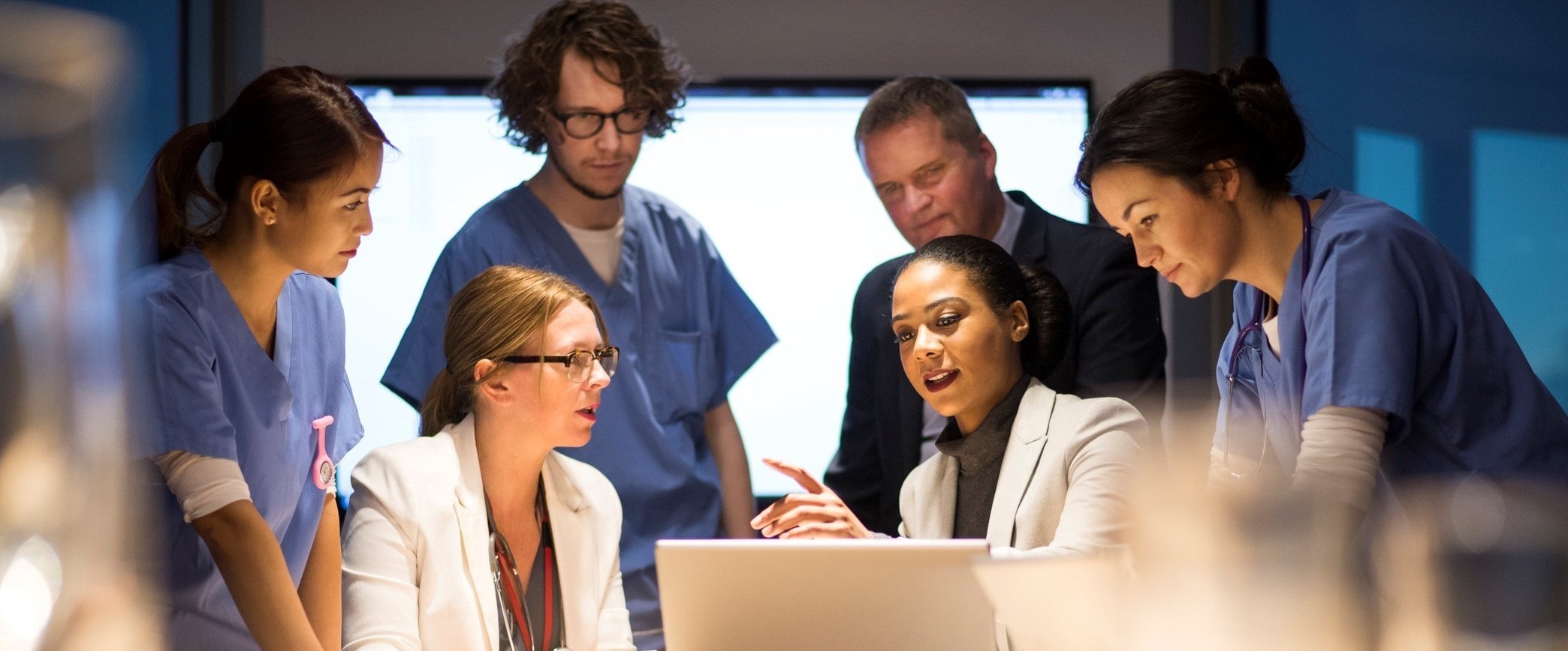 group of medical professionals at a meeting