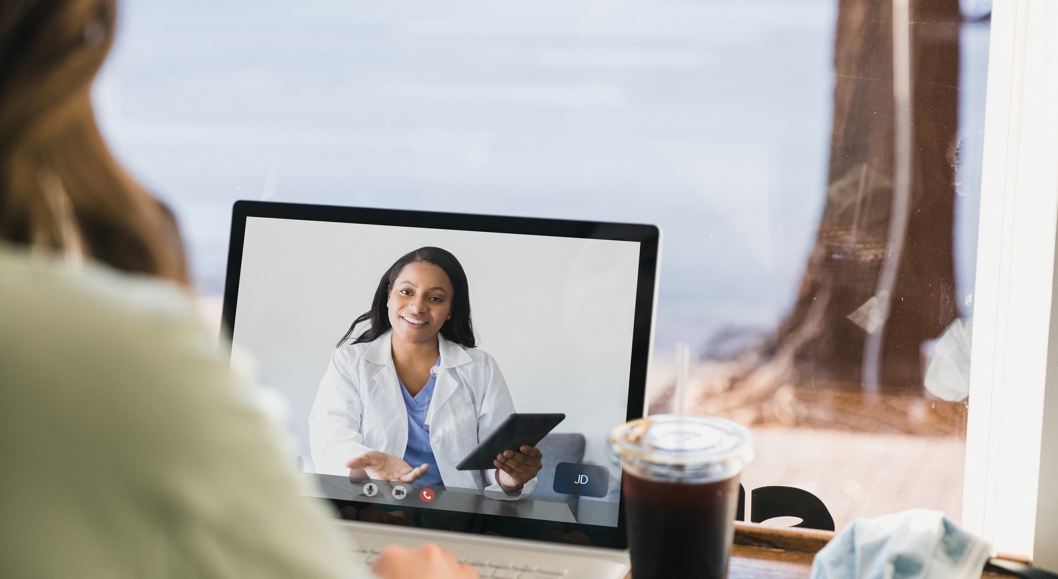 Physician meeting with a patient on a telehealth visit