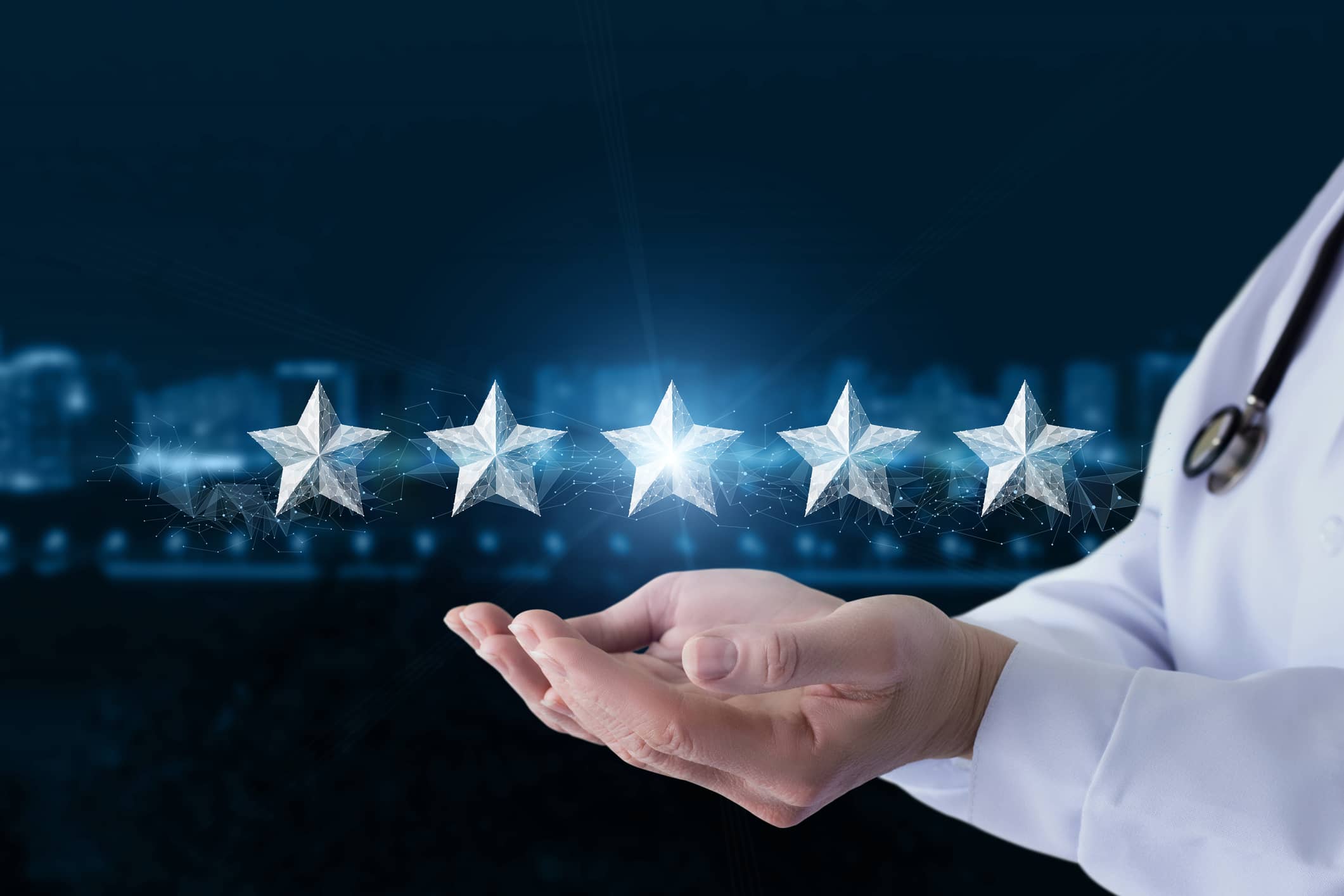 Doctor's hands with five stars floating above Doctor's hands with five stars floating above