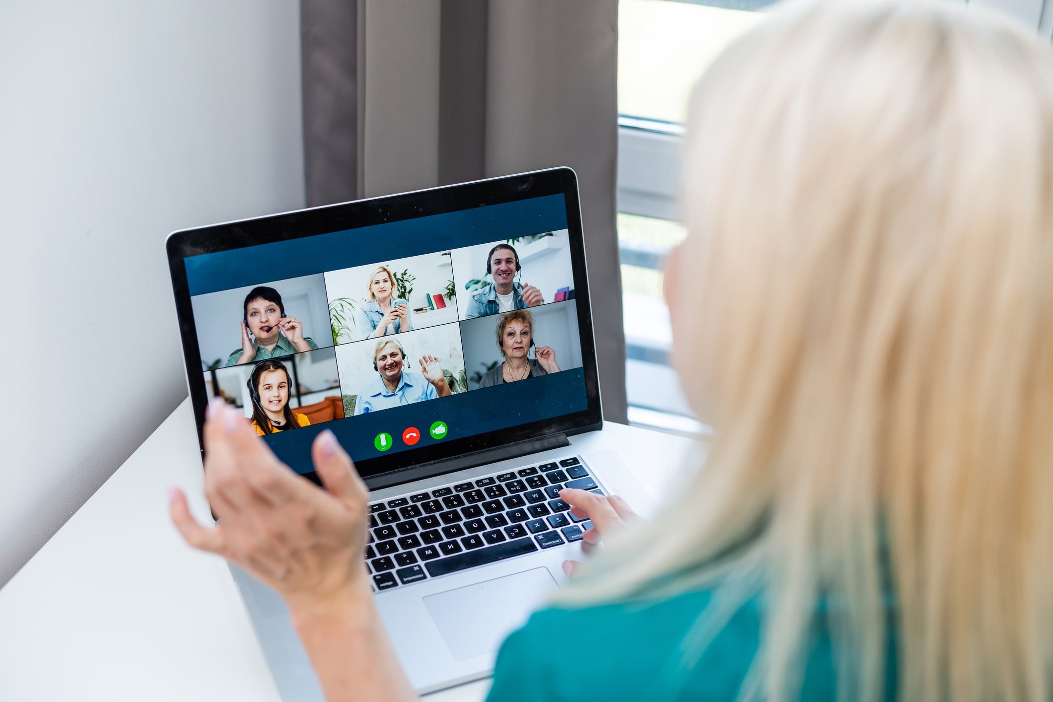 nurse in green scrubs speaks to video chats to several recruiters at once nurse in green scrubs speaks to video chats to several recruiters at once