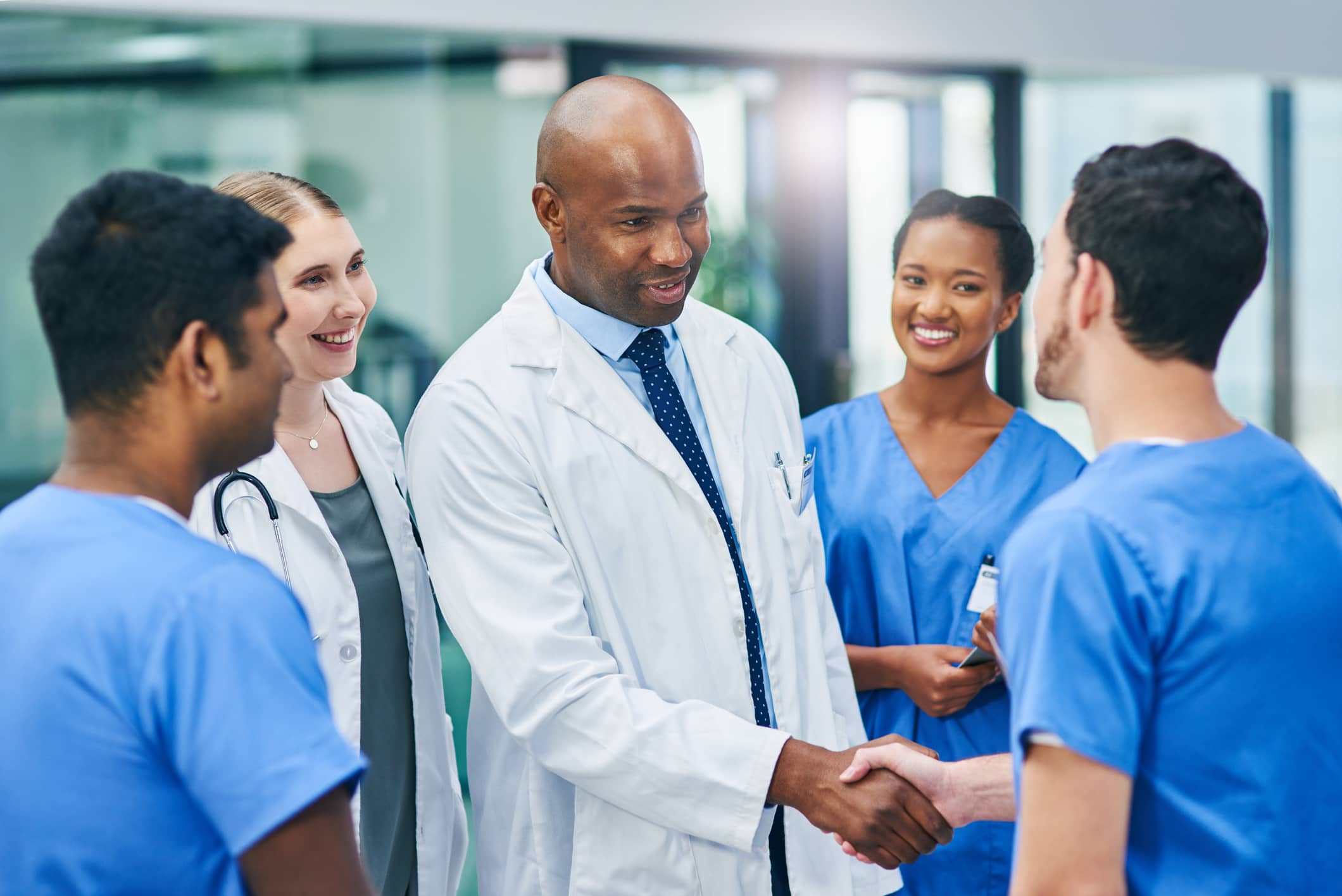 Doctor greeting medical staff Doctor greeting medical staff