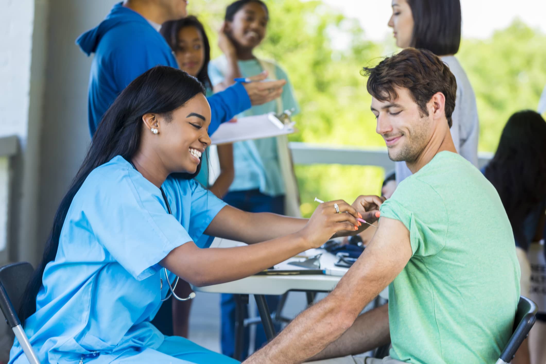 Nurse giving patient injection Nurse giving patient injection