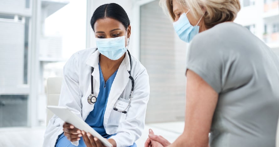 doctor consulting with patient in waiting room