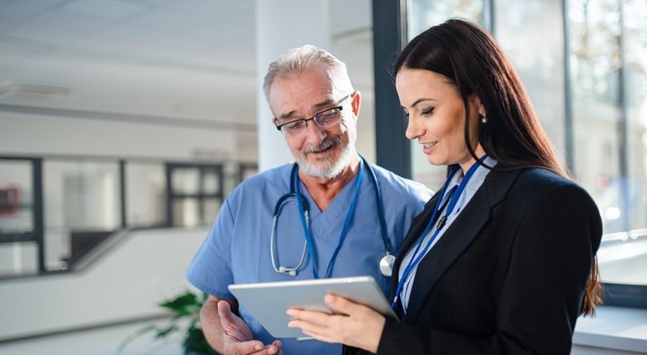 medical professional speaking with doctor