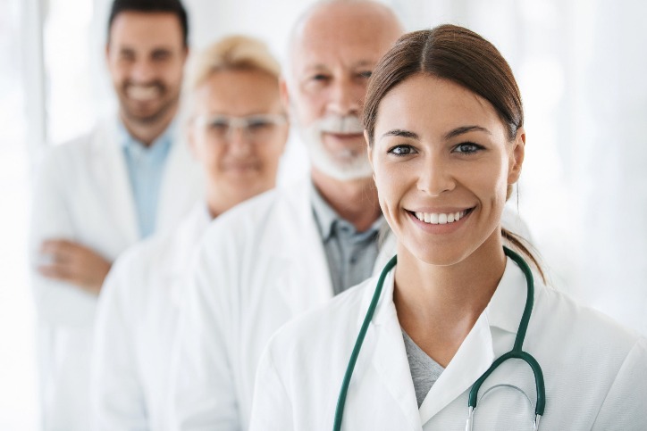 4 Physician Assistants standing together