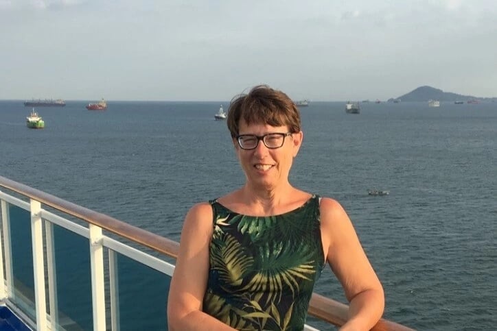 Mary Schnorbus with a body of water in the background