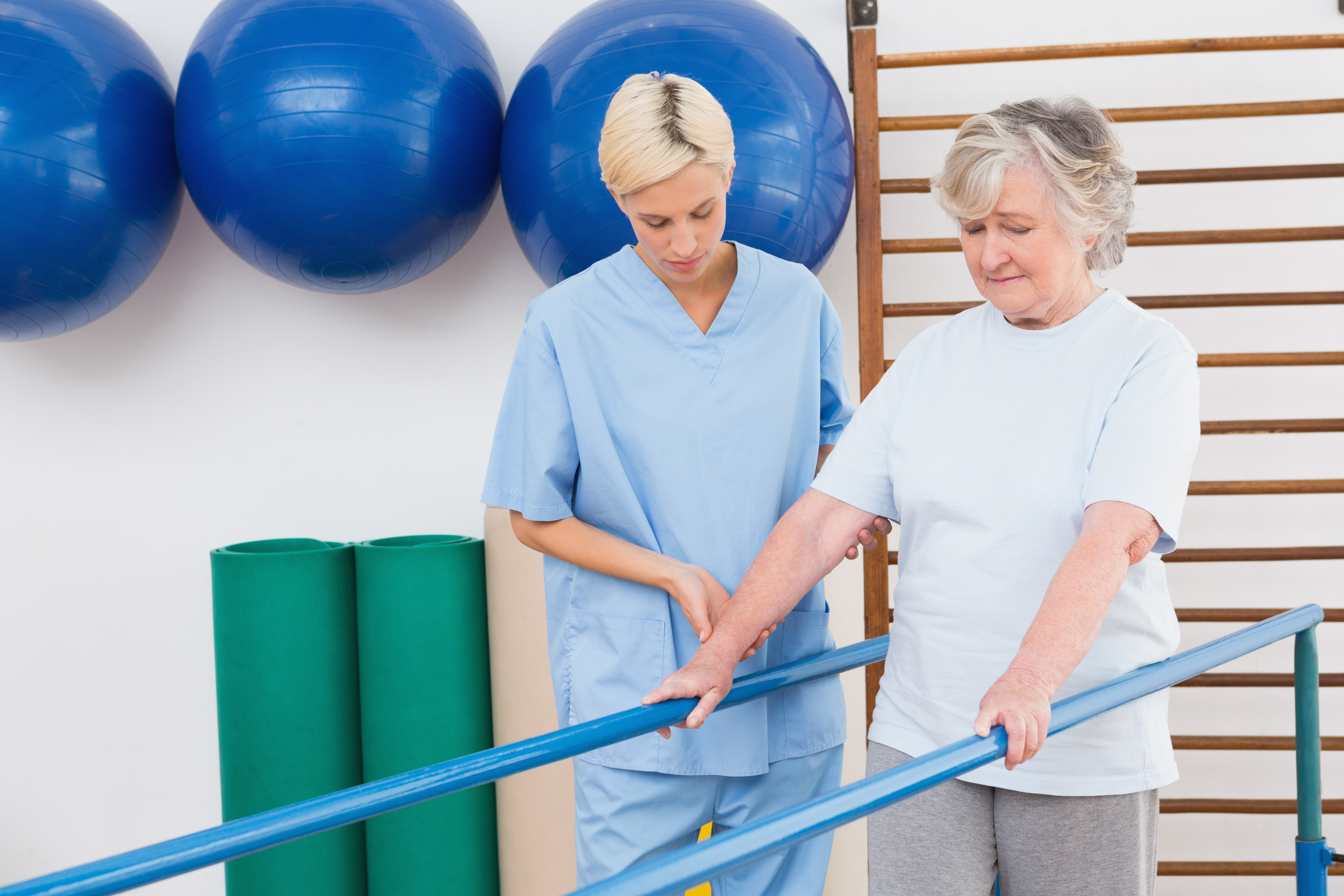 Travel physical therapist working with an older patient