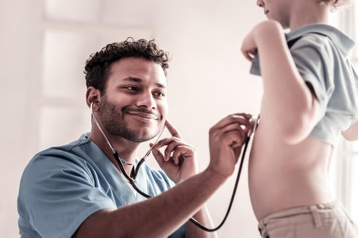 Respiratory therapist checking patient's heart