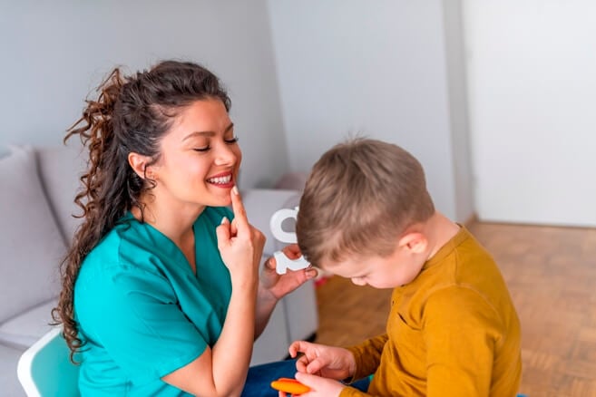 SLP helping a child with autism