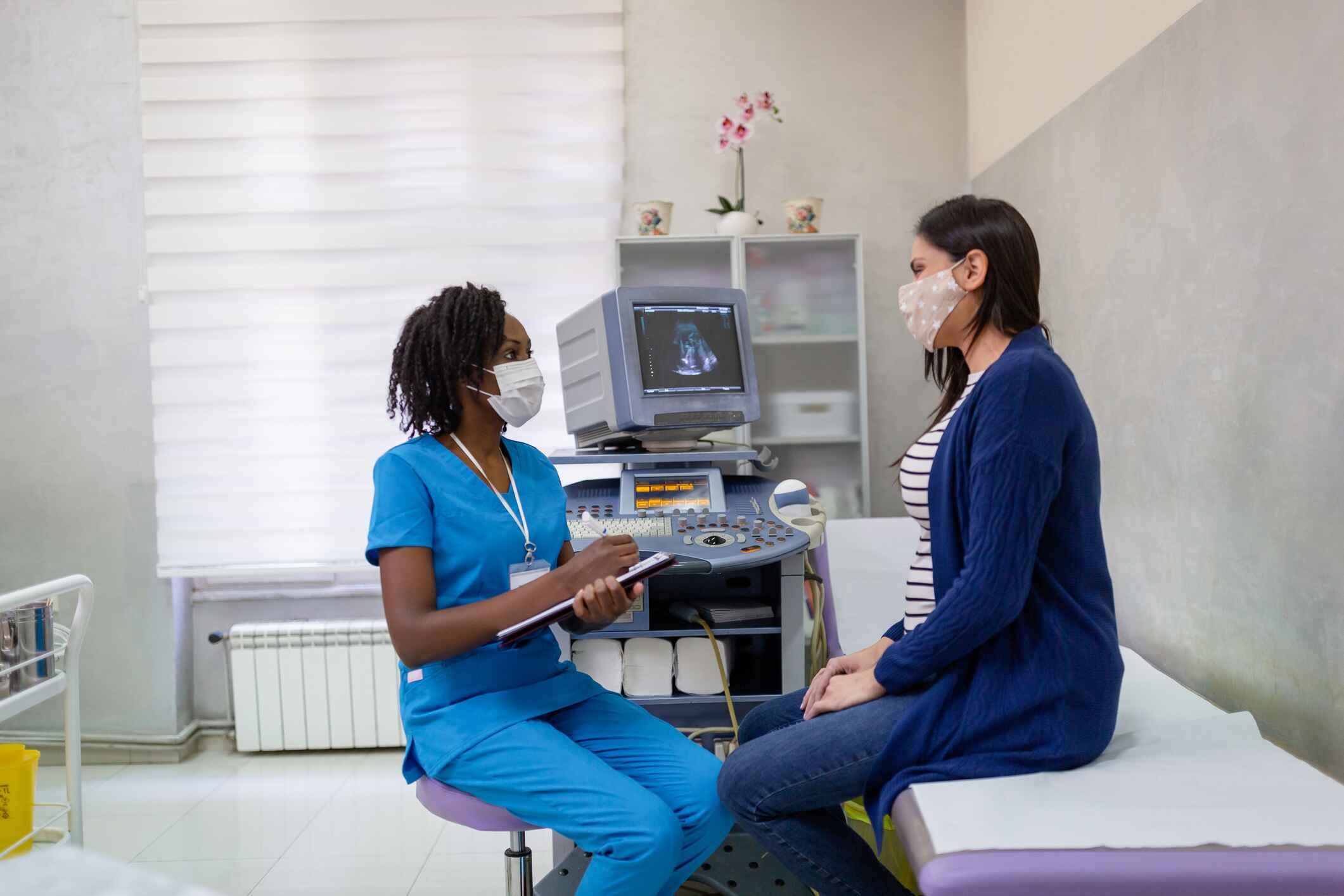 Sonographer chatting with a patient