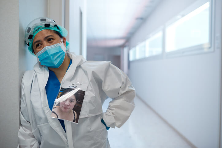 Nurse standing in hospital dressed in PPE