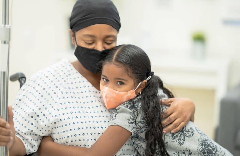 caner patient and child wearing mask