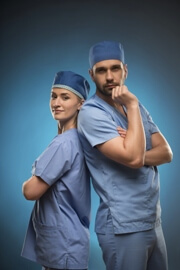 Dr and nurse standing with their backs to each other