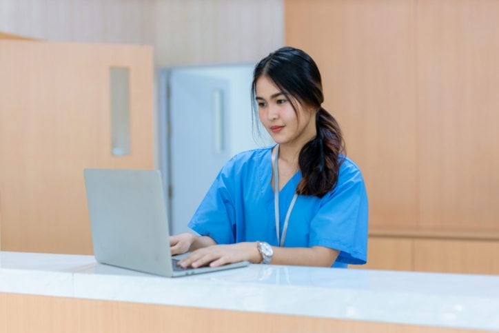 Travel nurse on laptop