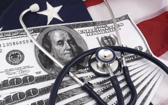American flag with a stethoscope and money on top