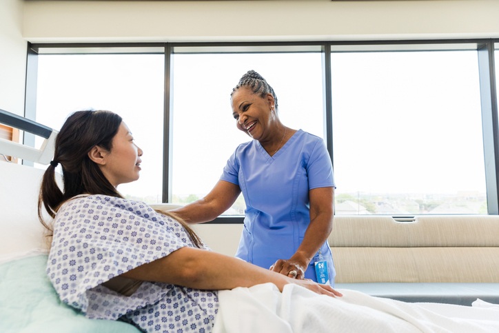 nurse talking to patient
