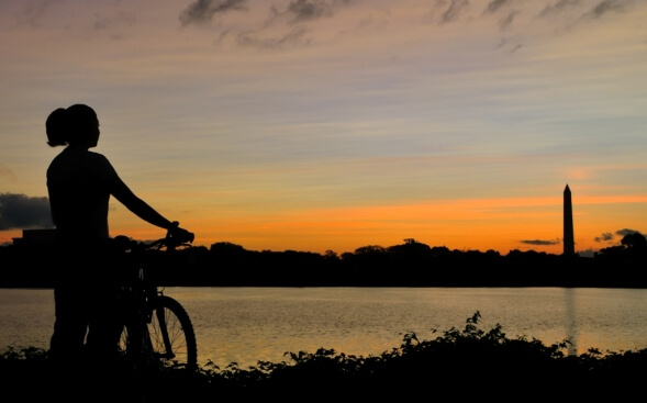 woman biking near the potomac river