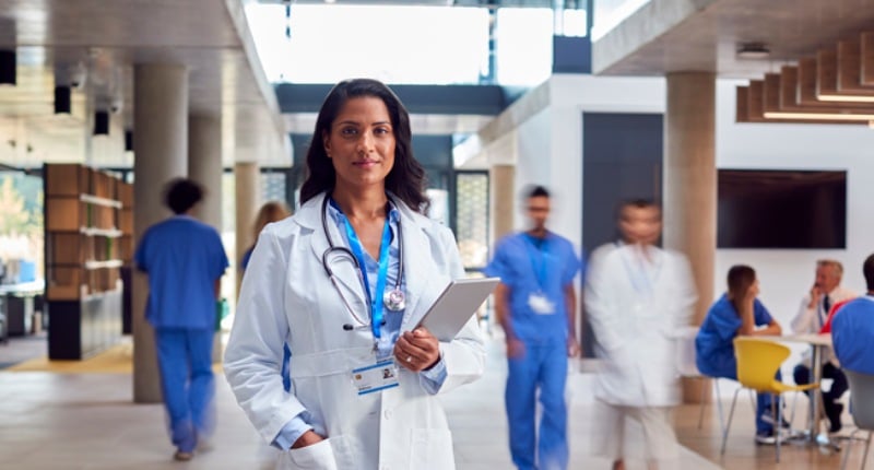 a physician holding an ipad