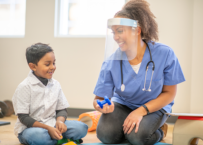 SLP clinician working with young child