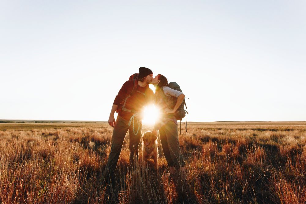 couple hiking with dog