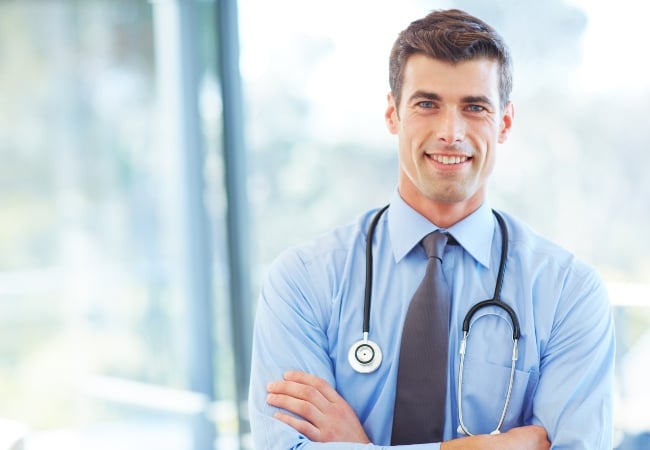 Doctor standing with arms crossed