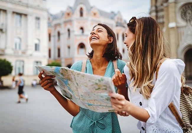 Two travel nurses laughing