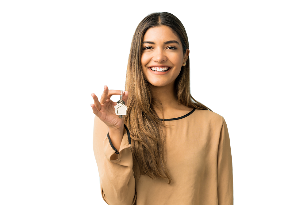 a travel nurse smiling and holding her house keys in front of her