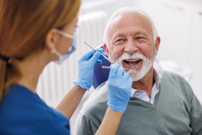 Senior patient with a dentist getting a cleaning and checkup