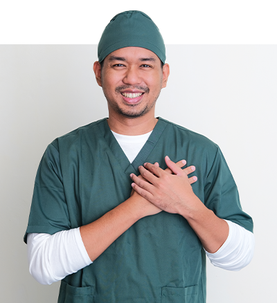 Male surgeon smiling while holding his hands together