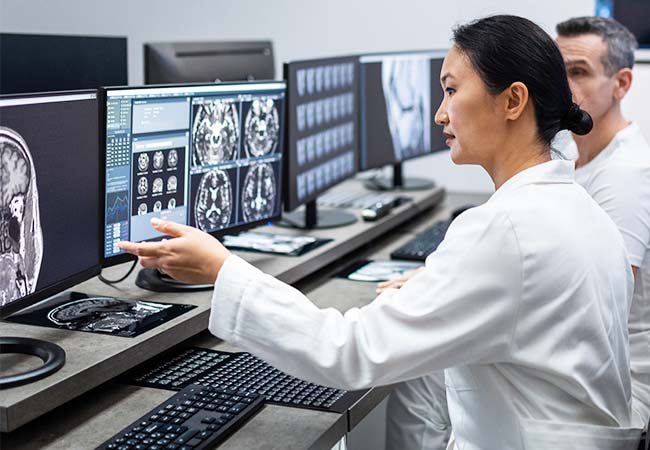 Physician looking at x-rays Physician looking at x-rays