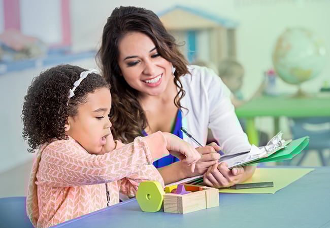 Therapist working with child