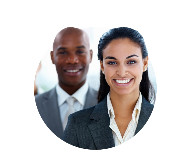 Woman executive smiling with male smiling behind her.