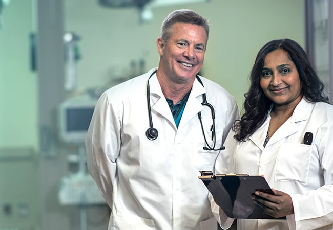 Male and female permanent physician in hospital setting