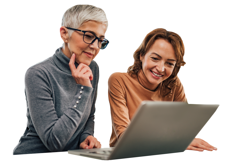 Two women looking at a laptop screen Two women looking at a laptop screen