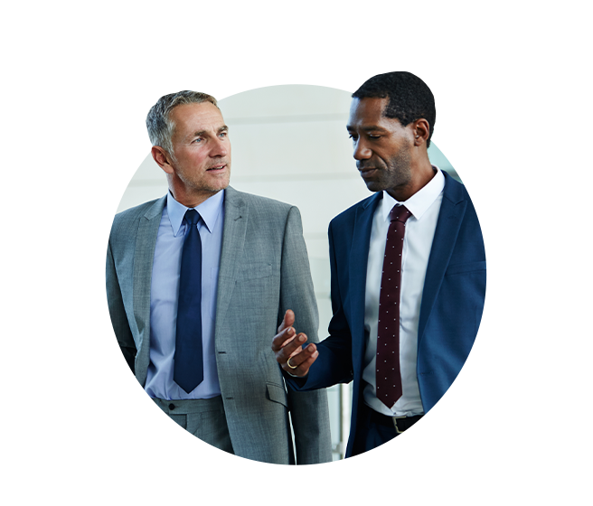 Two business men talking while walking